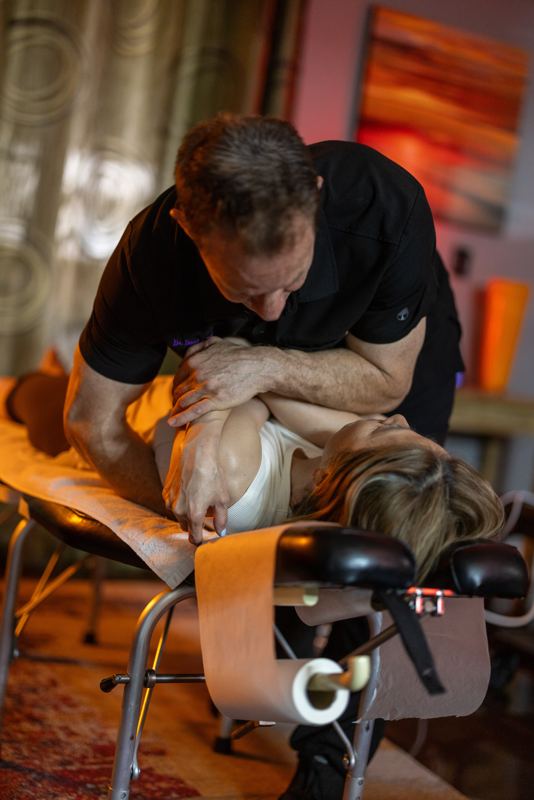 Dr. Bumgarner performing back treatment -- close-up clinical detail
