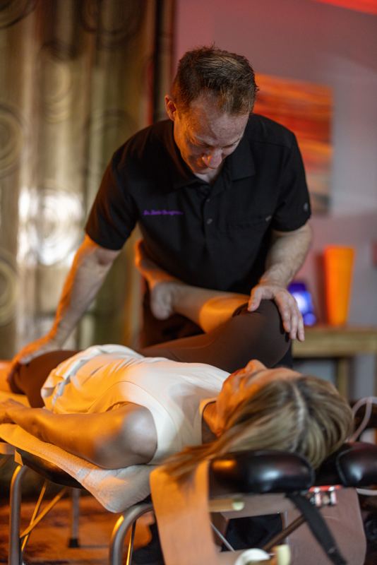 Dr. Bumgarner providing chiropractic care